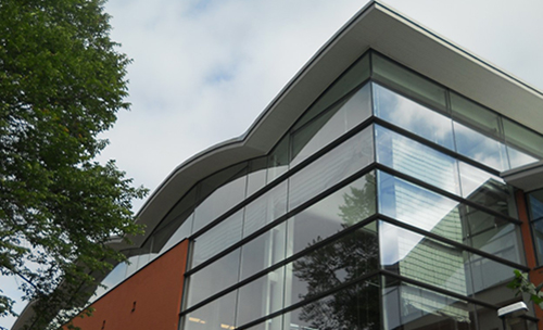 Detail of the Eriksdalsbadet building with glass facade.